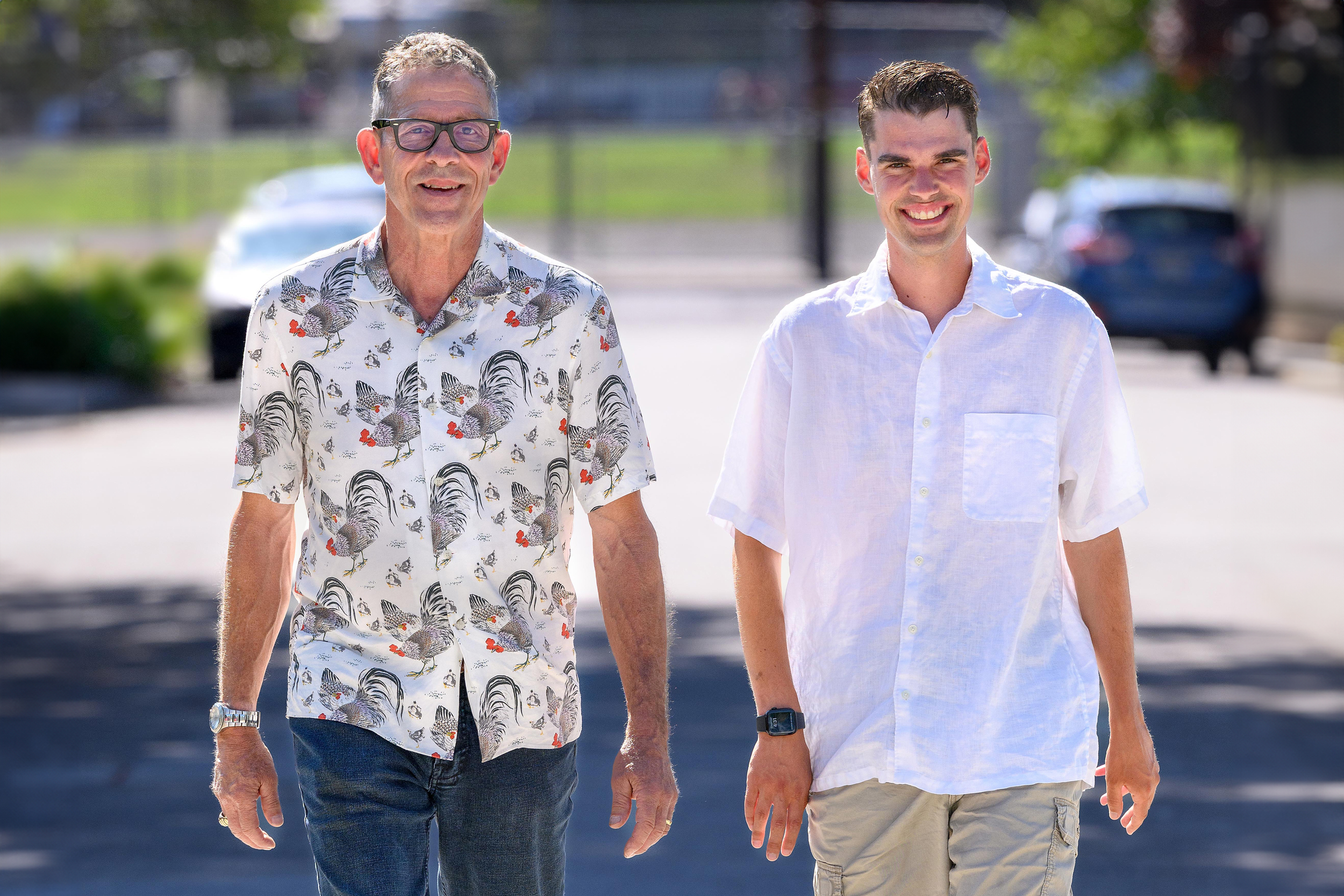 A photo of Joe Henry and his son, Franklin Henry, walking outside.