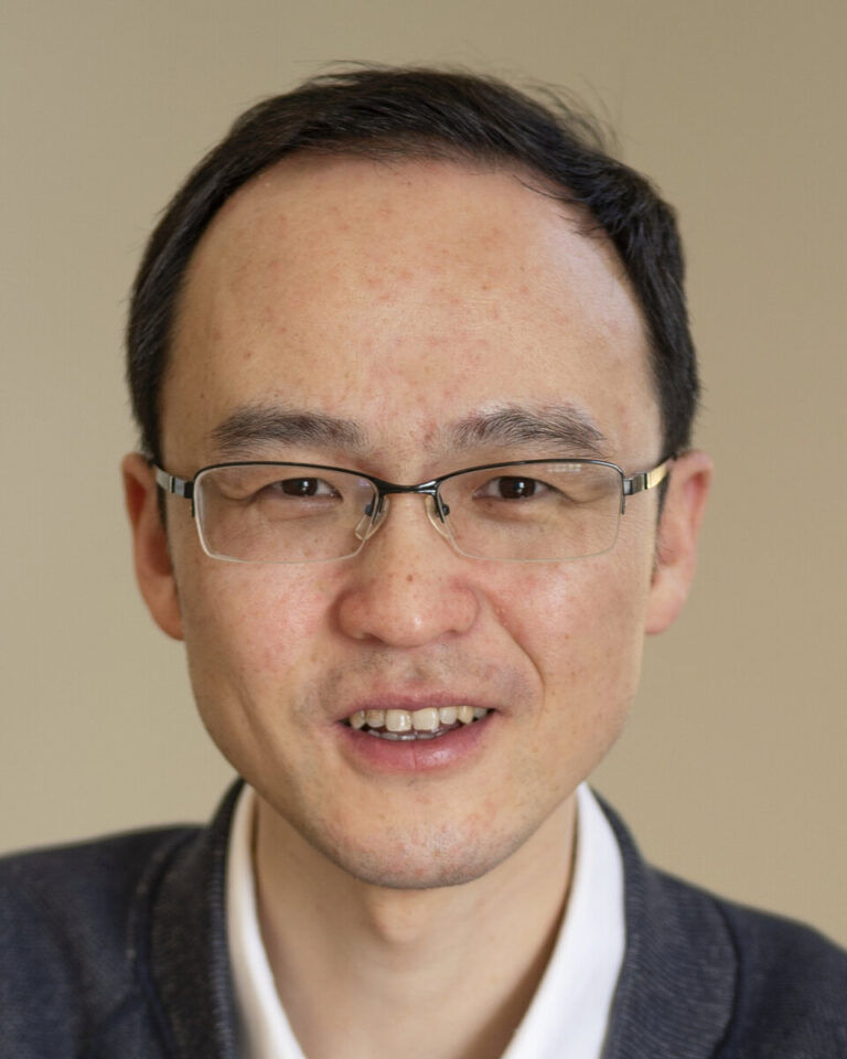 A portrait photo of Wei Zhang.