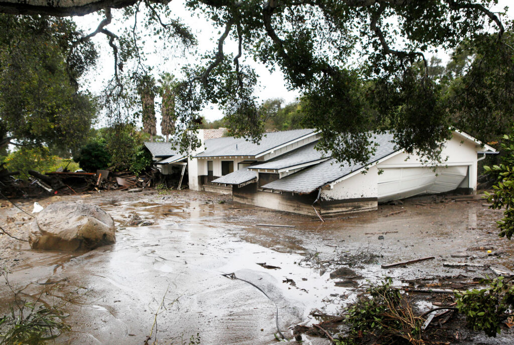 A photo of a house destroyed from flash flooding and debris along Olive Mill Road in Montecito, California, taken January 2018.