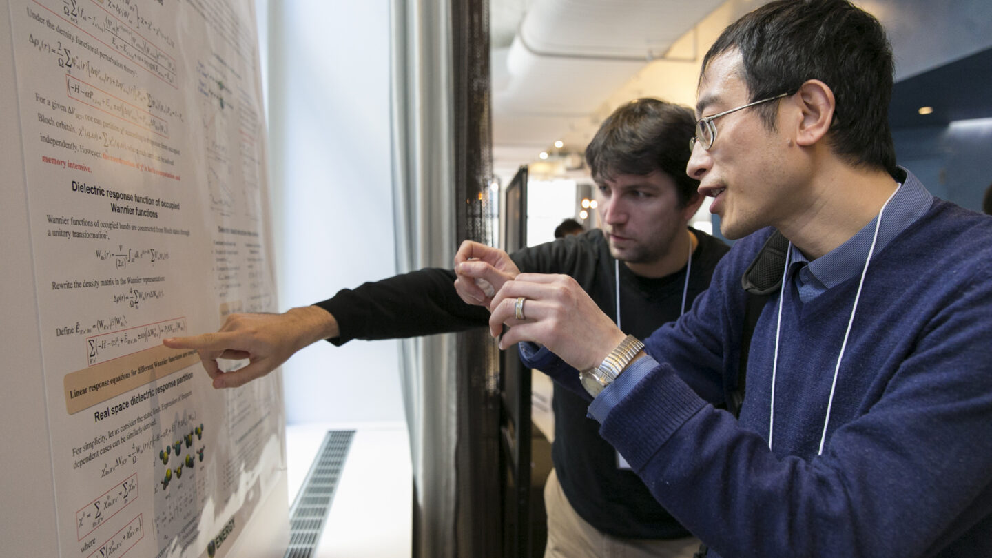 Two people looking at a presentation together