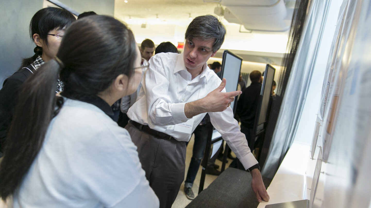 Two people looking at a presentation