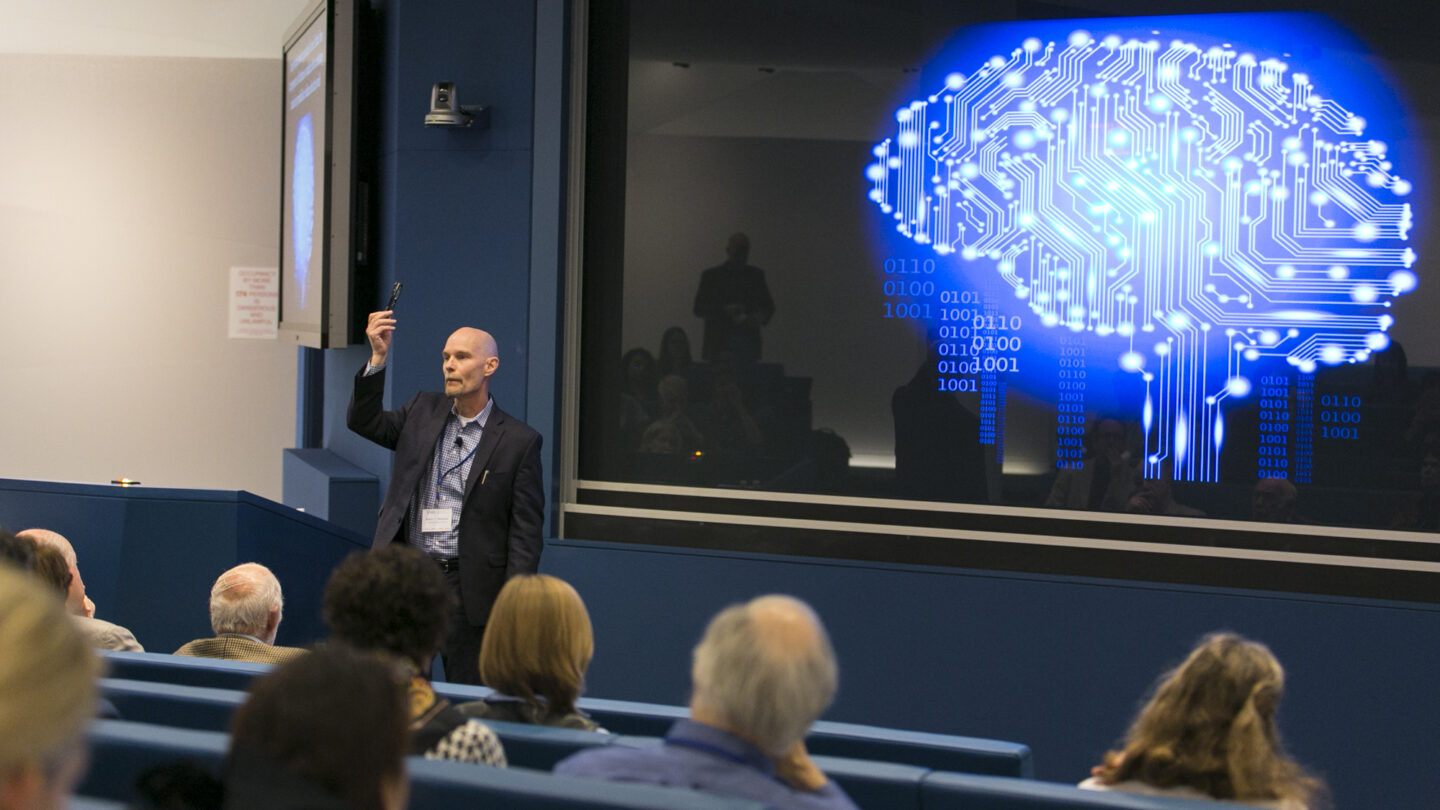 Man standing in front of a lecture hall
