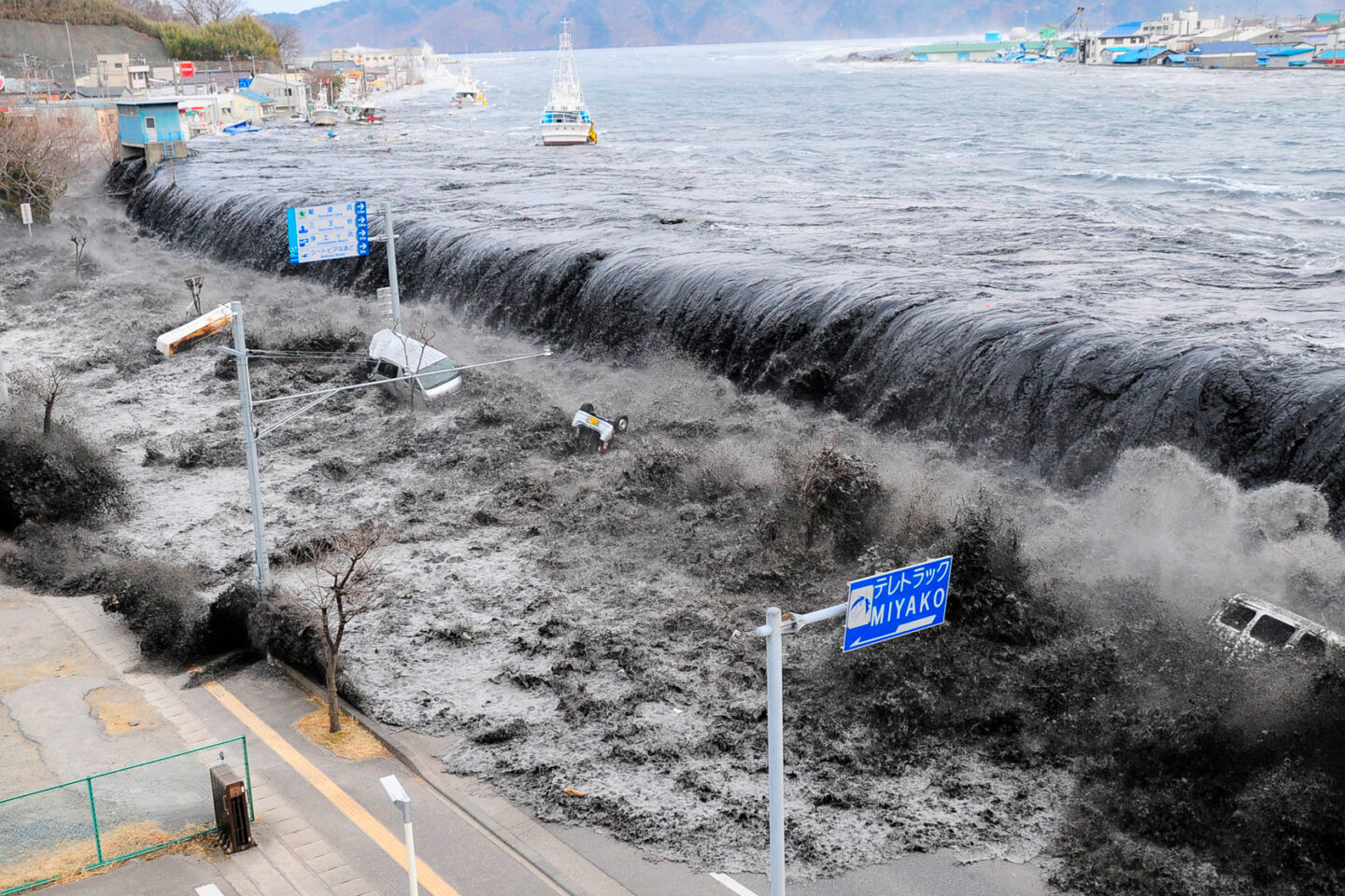 A photo of a large wave approaching Miyako City, Japan, after a magnitude 8.9 earthquake struck the area in Miyako, Japan, March 11, 2011.