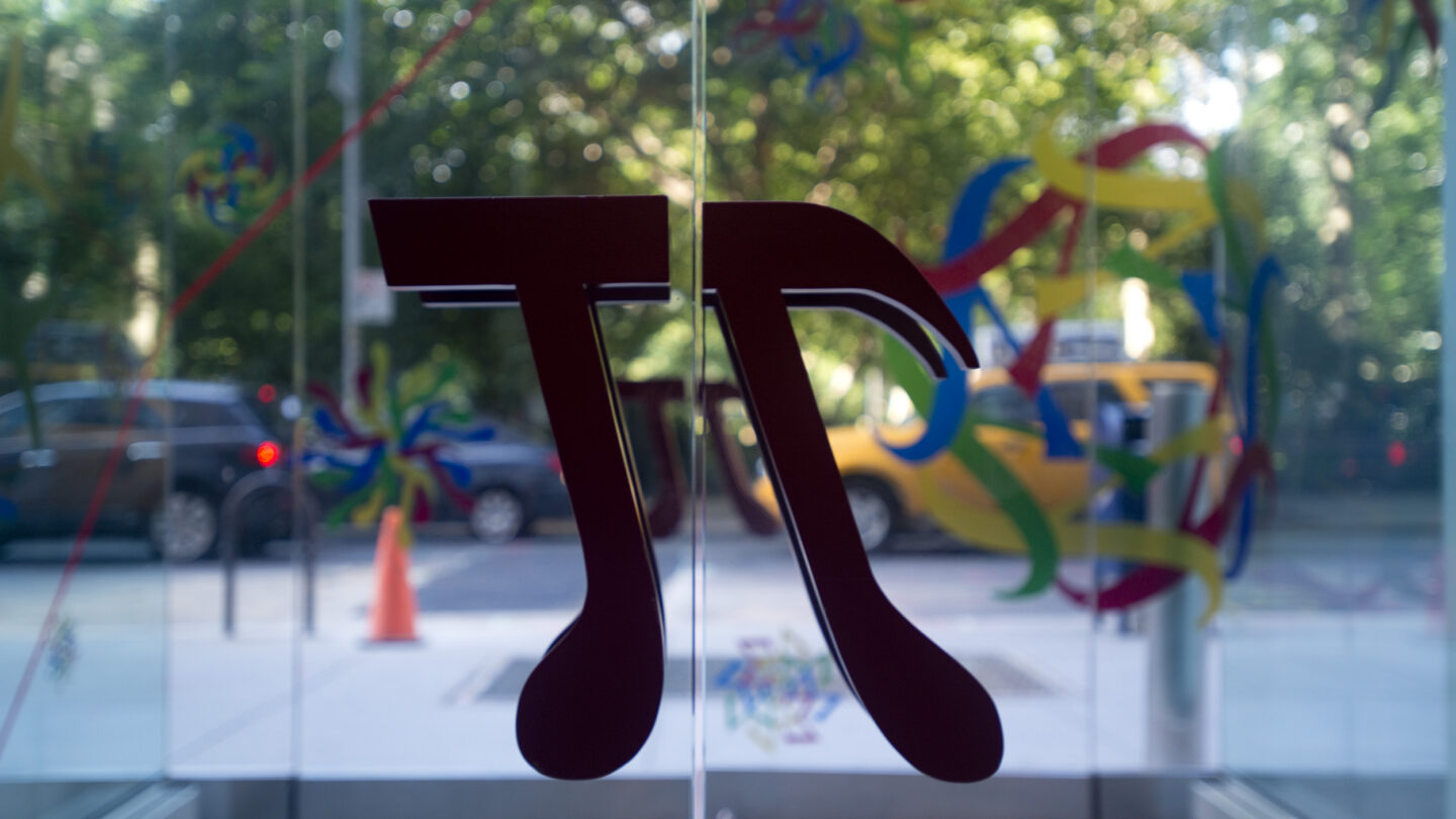 Pi symbol as door handles of glass doors