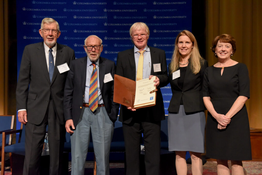 G. Michael Purdy, Jim Simons, Ferdi Schüth, Maya Tolstoy and Mary C. Boyce pose on stage following the signing ceremony