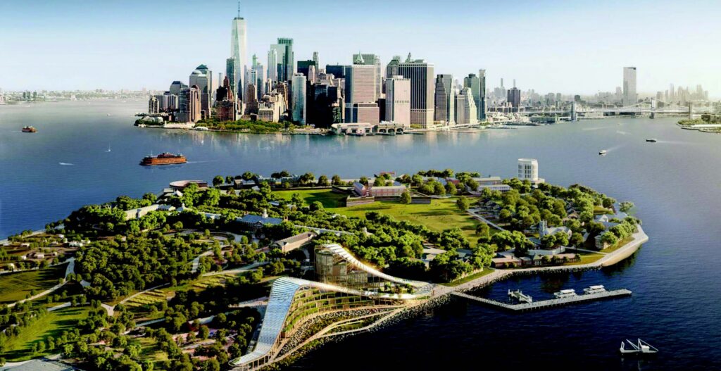A view of Lower Manhattans skyline across the water, with Governors Island in the foreground featuring green spaces, buildings, and walking paths. Boats are visible on the river.