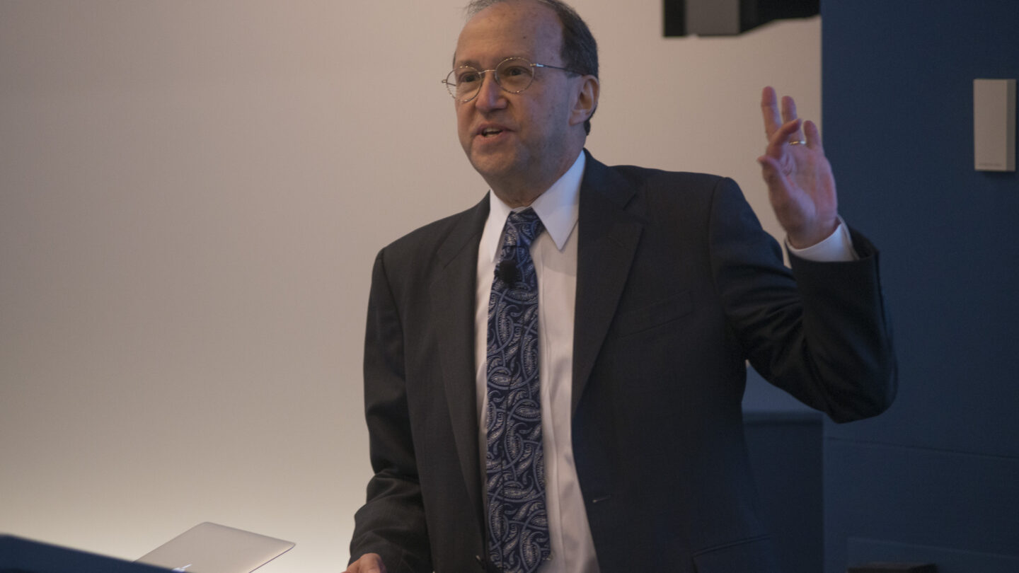 Man standing behind a lectern