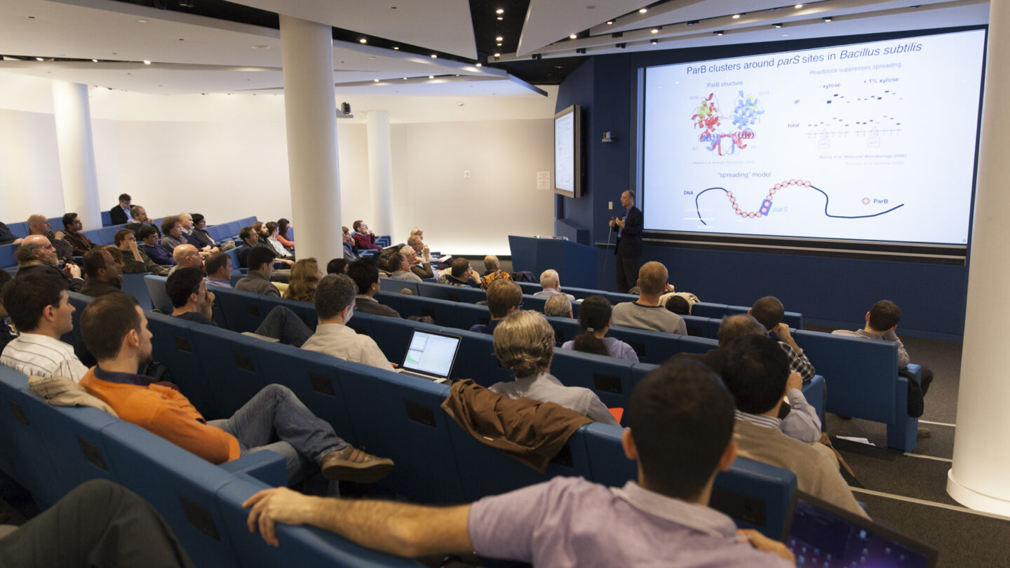 Lecture hall of people watching a lecturer