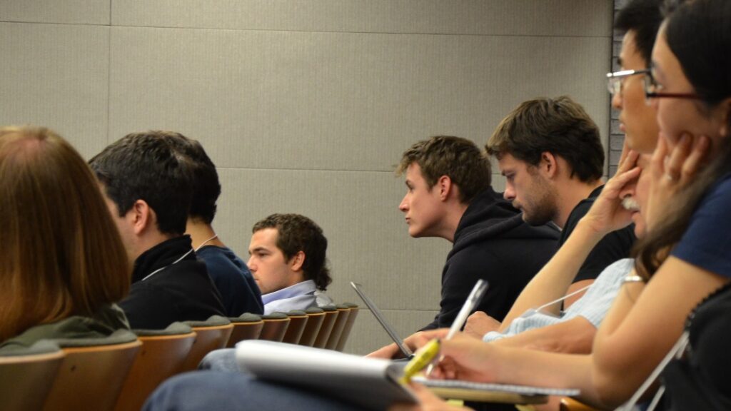 Two rows of people in a lecture hall