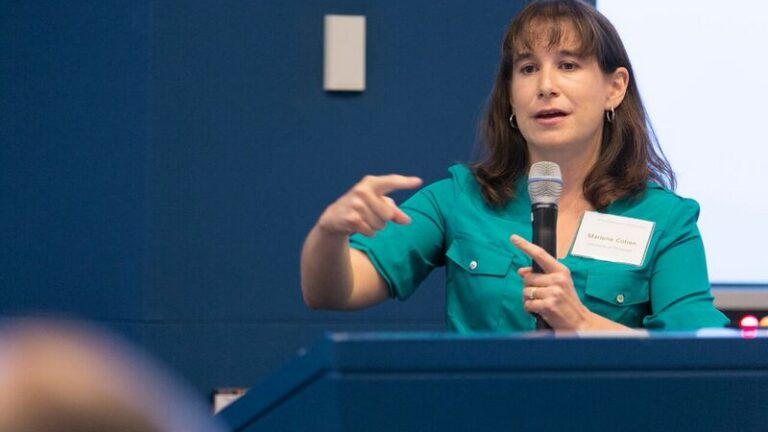 Marlene Cohen talking while gesticulating with her right hand