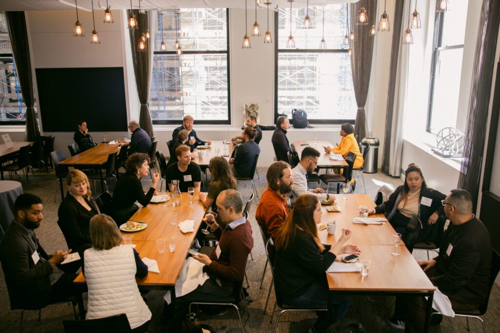 people gathered at tables talking