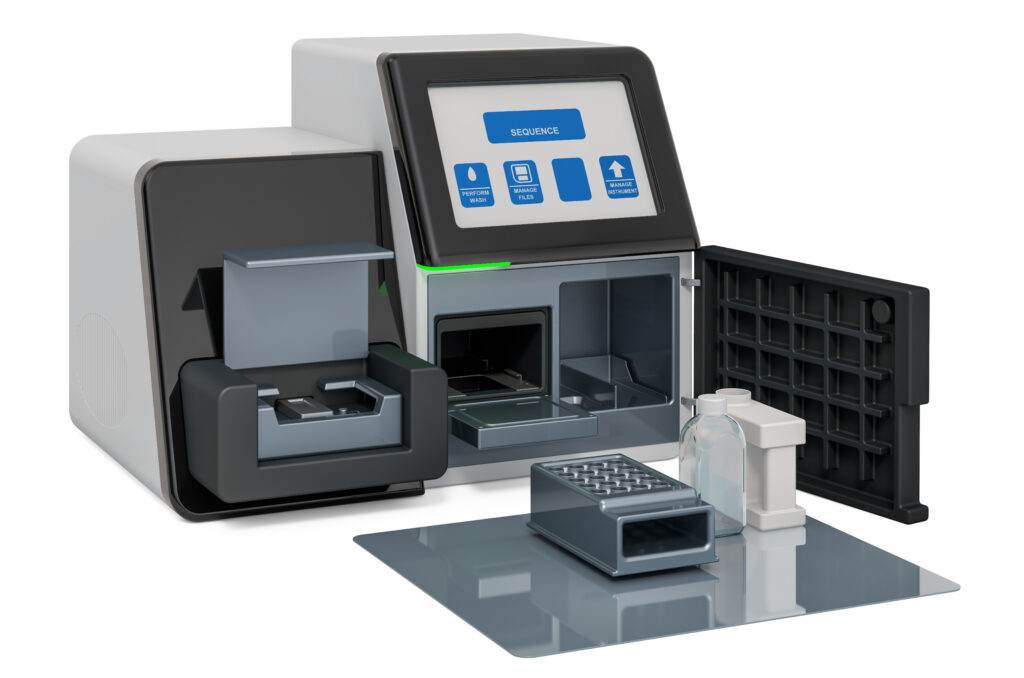 A modern DNA sequencing machine with an open compartment, display screen, and accessories including reagent bottles and sample trays arranged nearby.