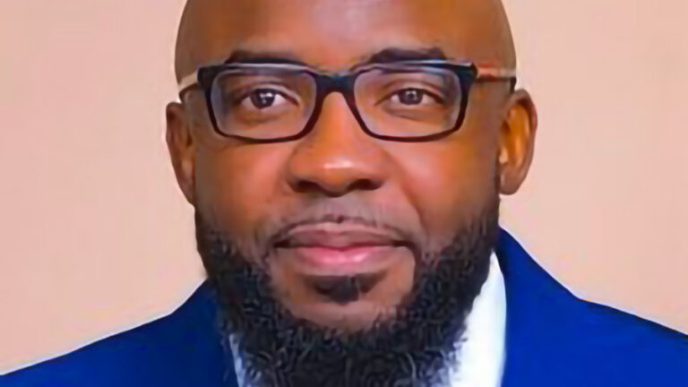 A portait photo of Andre Toussaint.