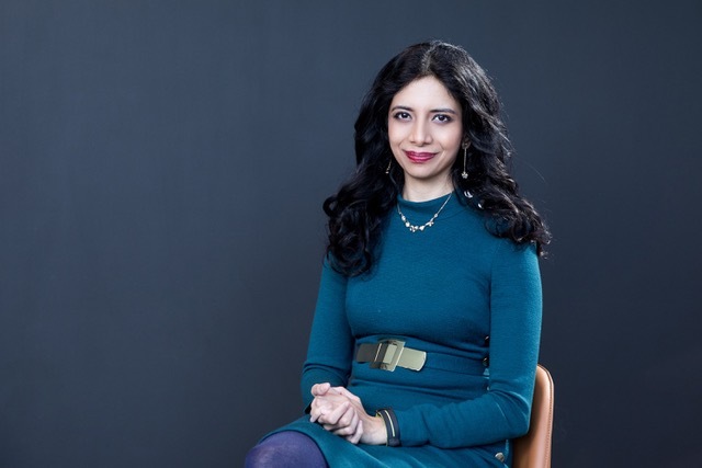 Portrait photo of Animashree Anandkumar sitting down
