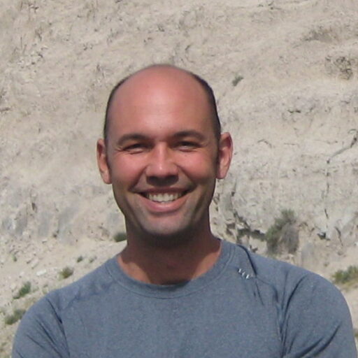 Tim Roughgarden in front of rocks