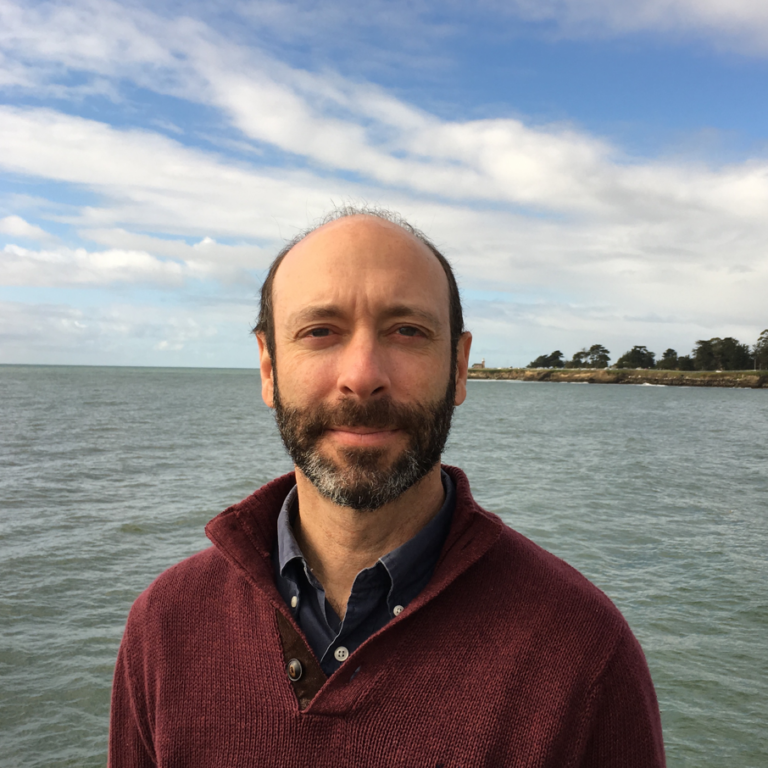 Christopher Edwards in front of water