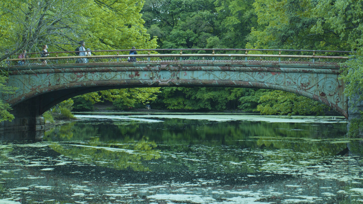 People walking across a bridge.