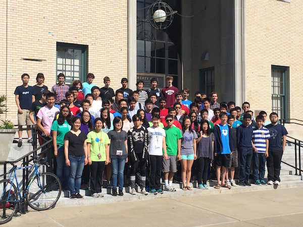 Large group of people posing on stairs