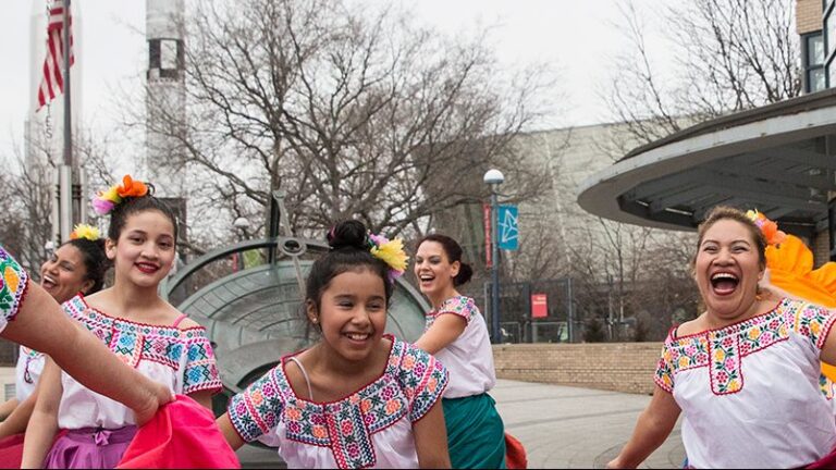 People dancing outside the New York Hall of Science in Queens