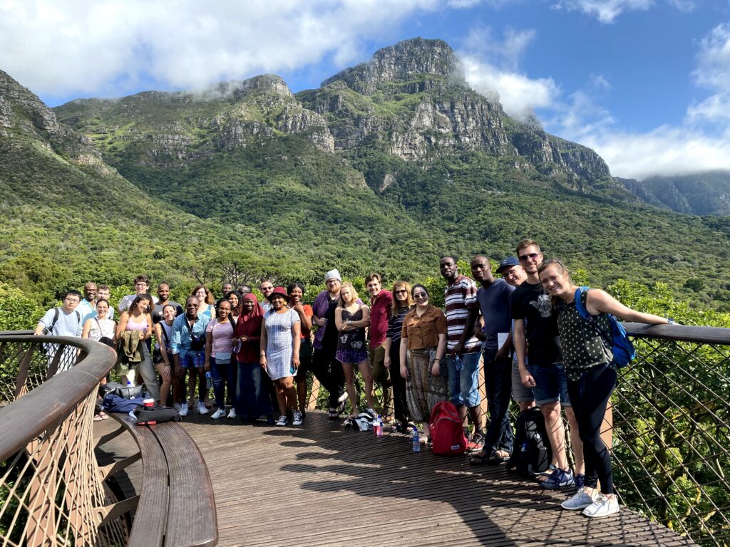 students in front of mountains