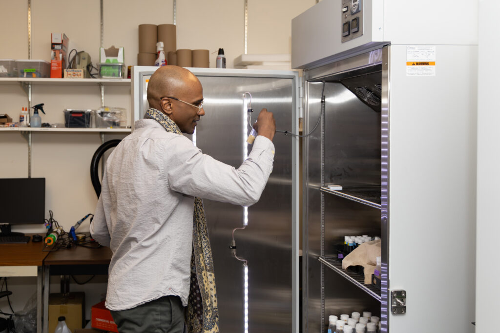 Portrait of Sama Ahmed inside his lab at the University of Washington.