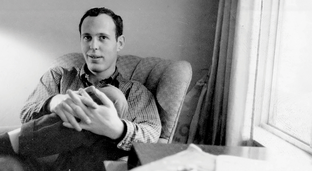Jim Simons sits in a chair in an office.