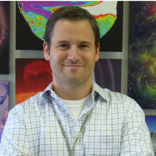 Joel Hurowitz in front of galactic art