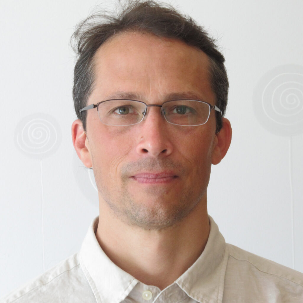 Portrait photo of Adam Kohn