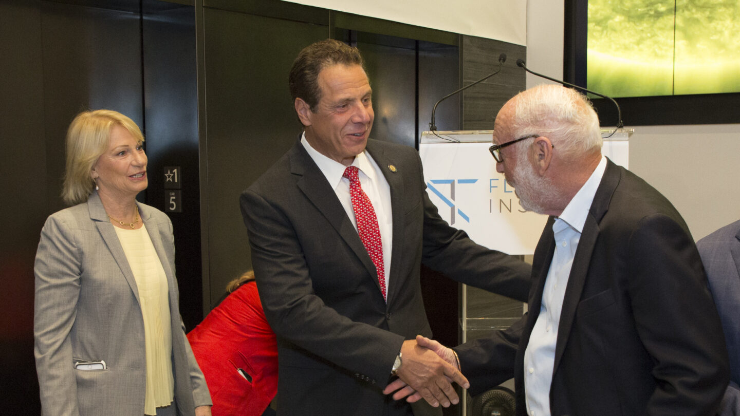 Gov. Andrew Cuomo (center) meets with Jim and Marilyn Simons during the Flatiron dedication ceremony