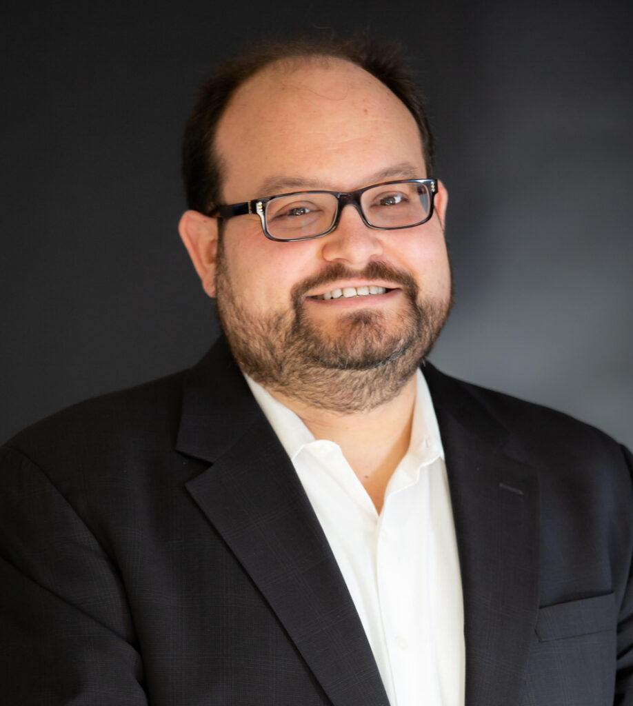 Man wearing white shirt and black suit jacket