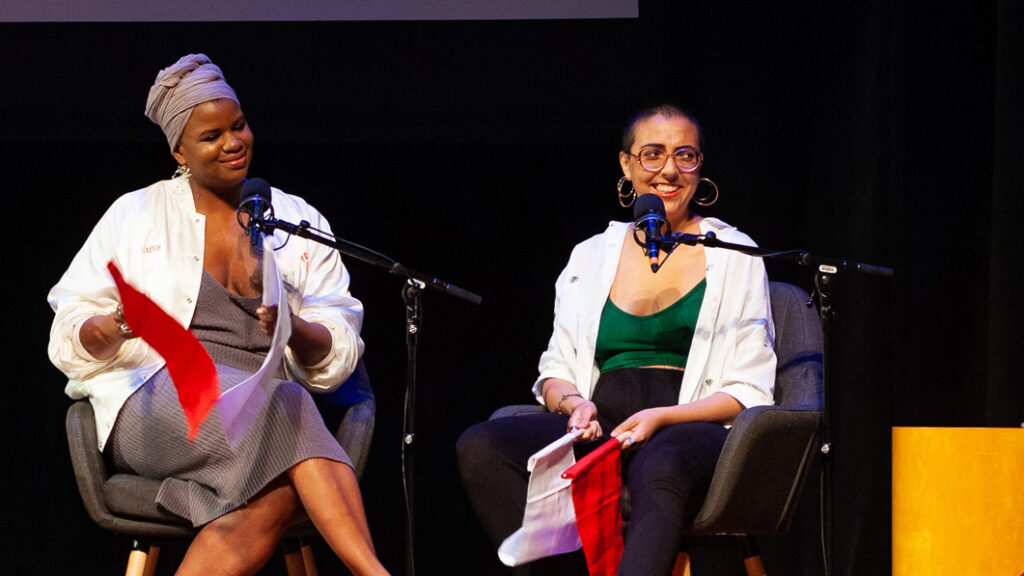 Four people sitting on individual couches on a stage during Radiolab's 
