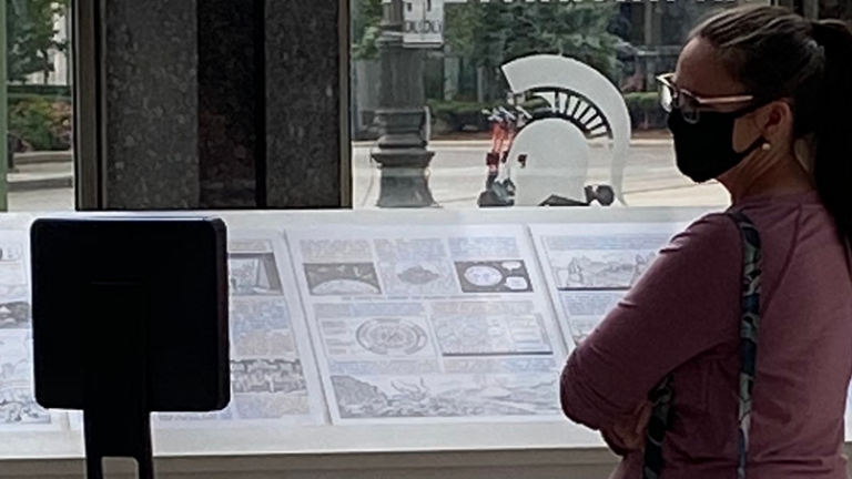 woman looking at signs in museum