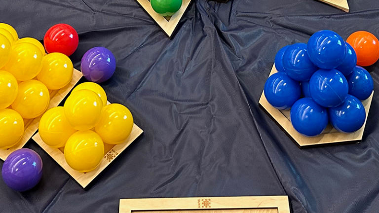 colorful balls on a black table cloth