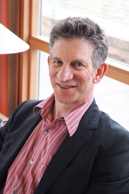 Peter Sarnak sitting by a window