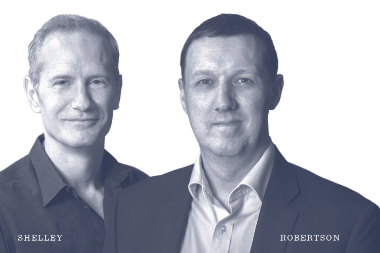 Two men stand side by side, both in collared shirts. The man on the left is labeled Shelley, and the man on the right is labeled Robertson. The background is plain white.