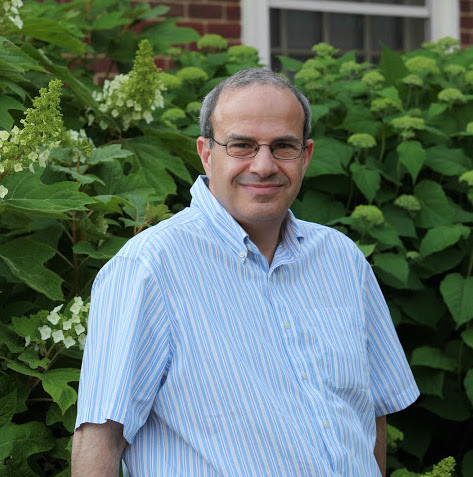 Nathan Seiberg in front of greenery