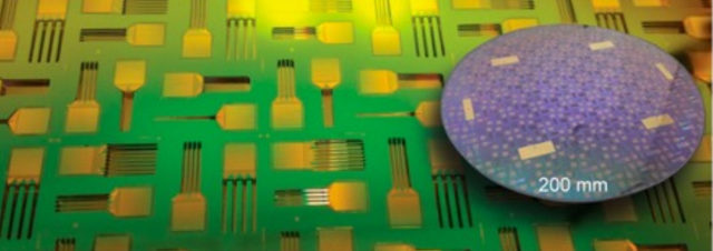 Close-up of a green and gold microchip circuit board with a round, blue-tinted silicon wafer overlay showing multiple microchips. A 200 mm scale is visible on the wafer.