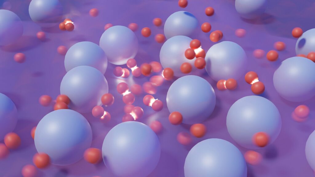 Large translucent blue spheres and smaller red spheres cluster on a purple surface. Some red spheres are grouped, with a few glowing white areas, giving a scientific or molecular appearance.