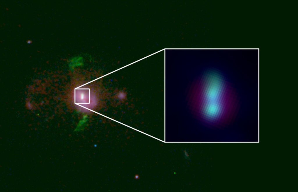 An image of a galaxy with bright blobs stacked on top of one another in the middle. An inset shows a close up of the two blobs, which are the locations of supermassive black holes.