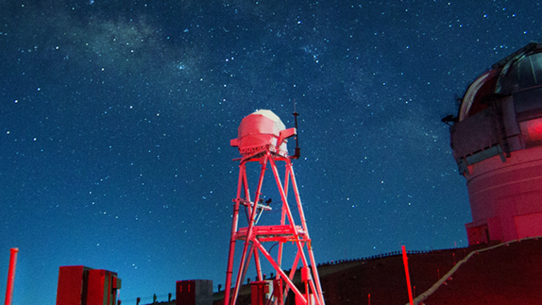 Observatory with red light shining on it