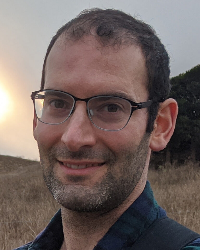 A portrait photo of Gregory Valiant.