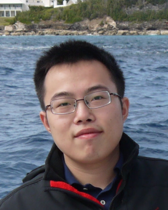 Xingchen Wang in front of a body of water
