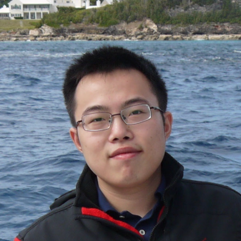 Xingchen Wang in front of a body of water