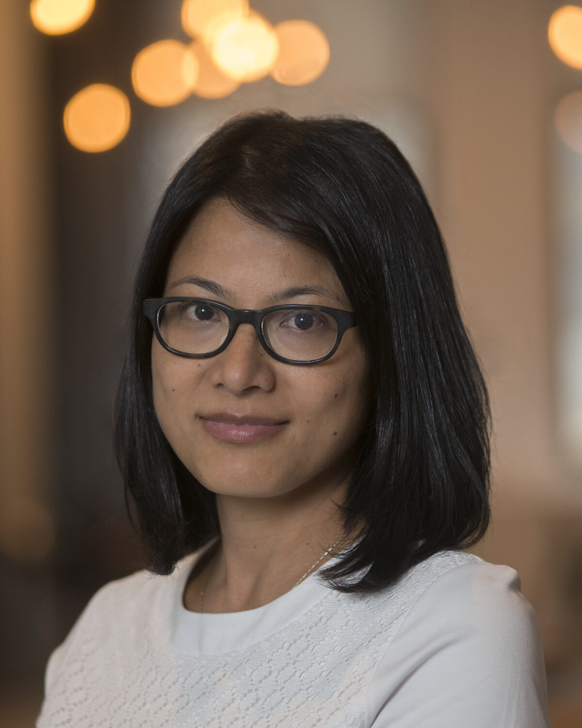 Portrait photo of Alpha Amatya