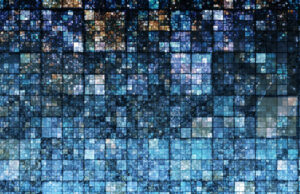 A mosaic of small, square tiles in various shades of blue, with some lighter and darker patches, creating an abstract, pixelated pattern resembling a digital or technological background.