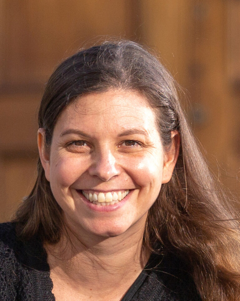 Portrait photo of Claudia De Rham