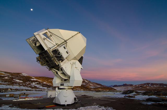 Huan Tran Telescope with sunset behind it