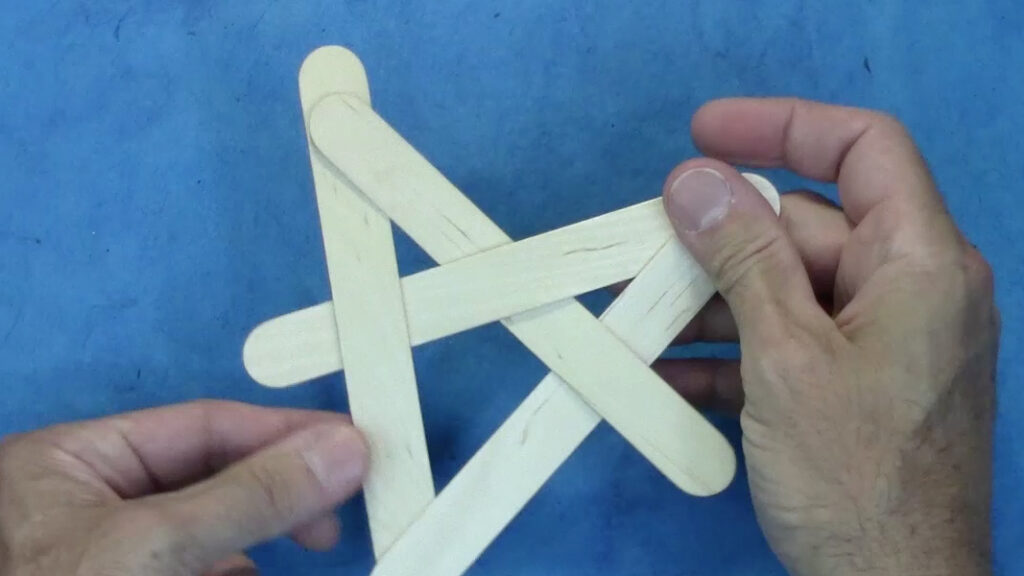 Four popsicle sticks intertwined