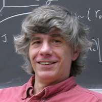 Sidney Nagel in front of a chalkboard