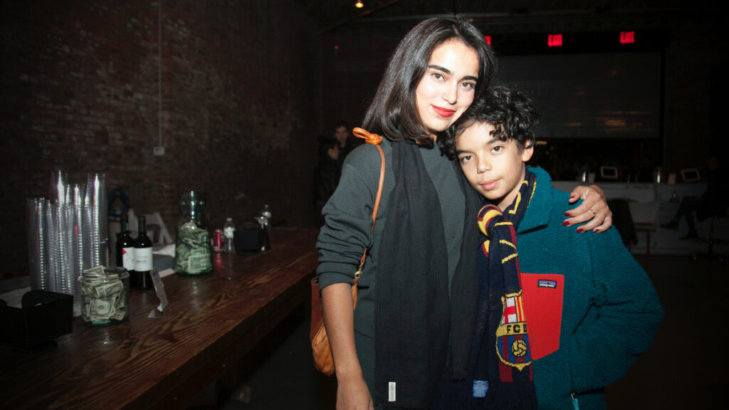 Woman putting an arm around a boy